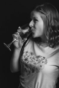 A photo taken on the Fujifilm X-T3. A photo of my partner Dani, sipping wine.